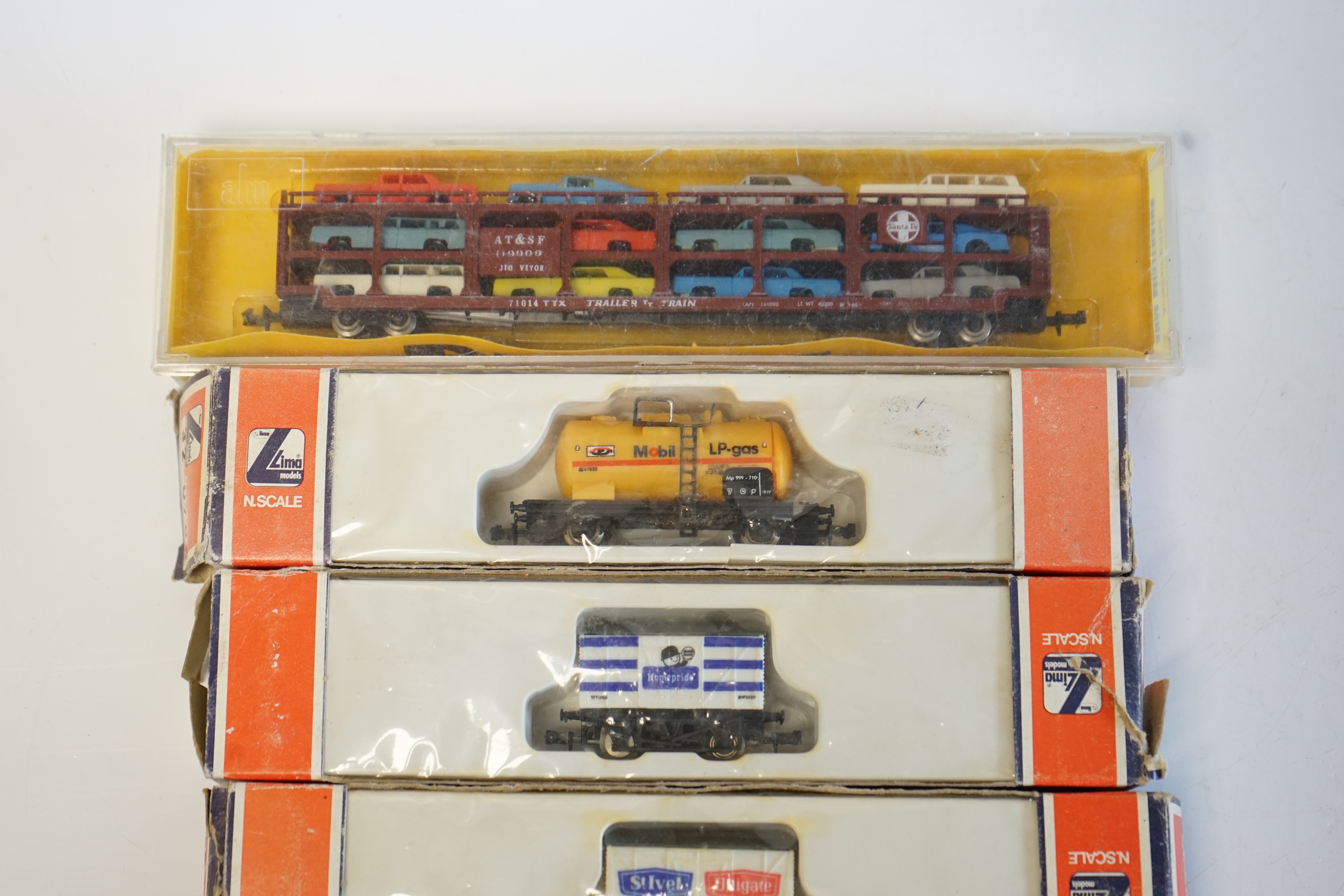 A quantity of N boxed gauge model railway by Graham Farish, Lima, Peco, etc., including five diesel locomotives, four in BR livery and one in Santa Fe livery, together with three Intercity corridor coaches, fourteen Brit